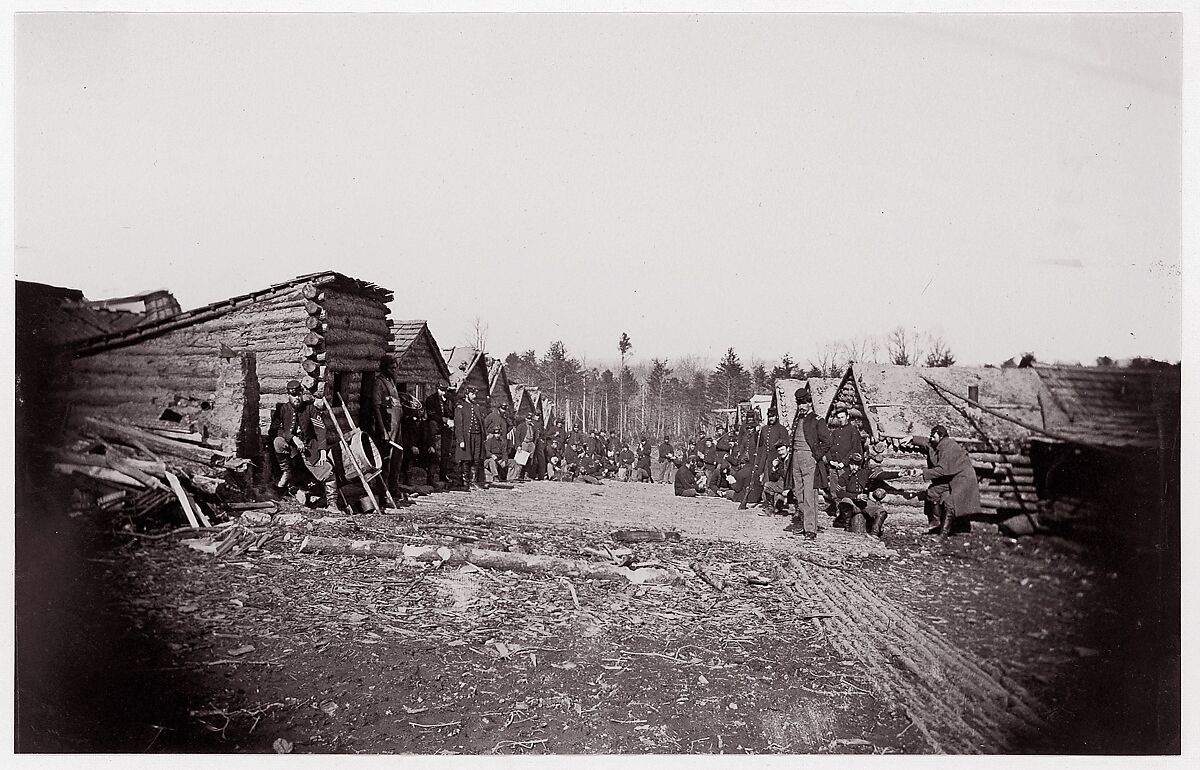 [Winter Quarters of Unidentified Union Army Regiment with Two Rows of Log Cabins], Unknown (American), Albumen silver print from glass negative 