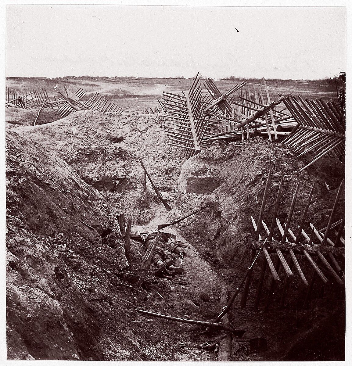 [Dead Confederate Soldier in the Trenches of Fort Mahone, Petersburg, Virginia], Attributed to Thomas C. Roche (American, 1826–1895), Albumen silver print from glass negative 