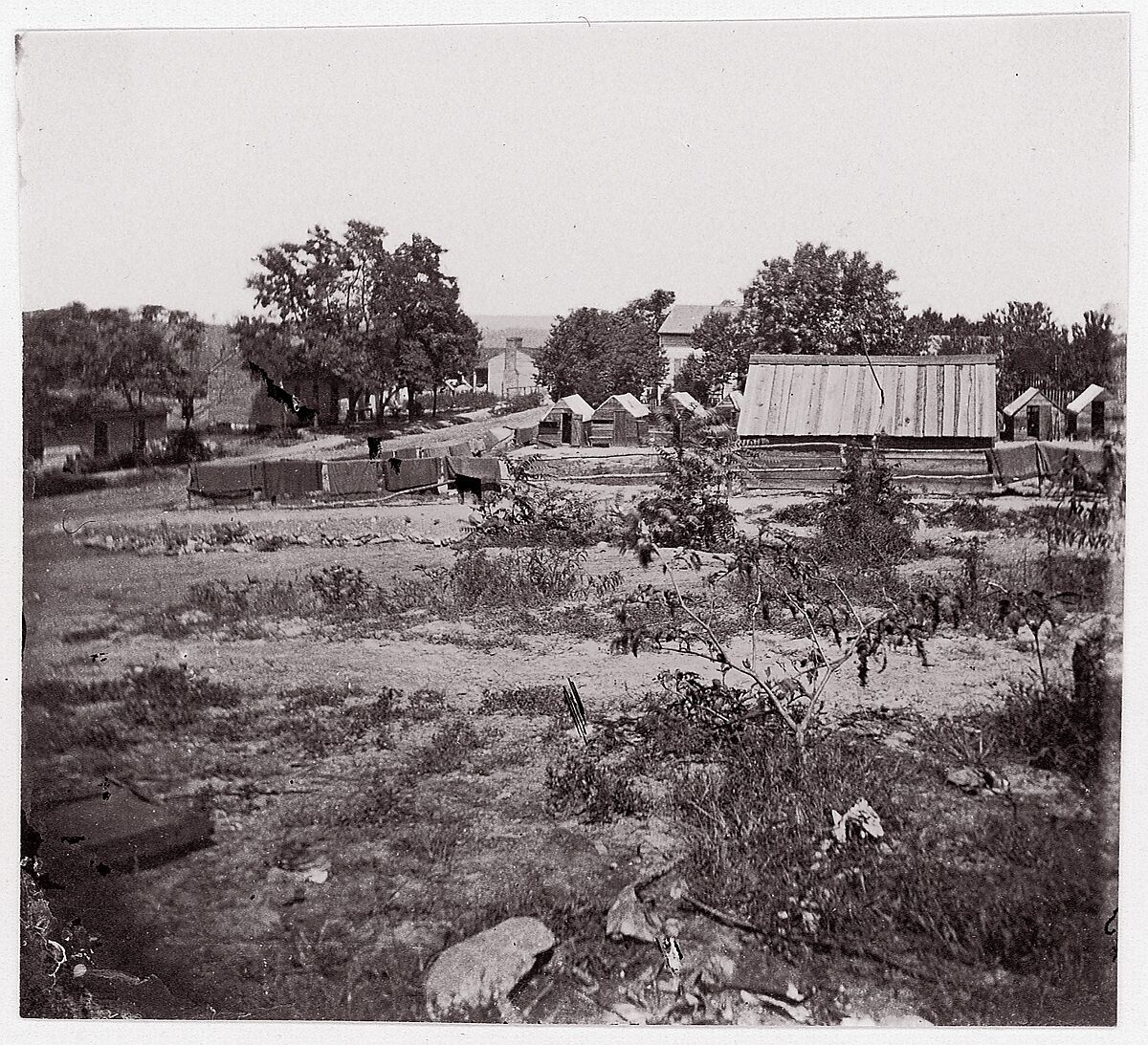 [View of a small town with wooden sheds in distance].  Brady album, p. 123, Unknown (American), Albumen silver print from glass negative 