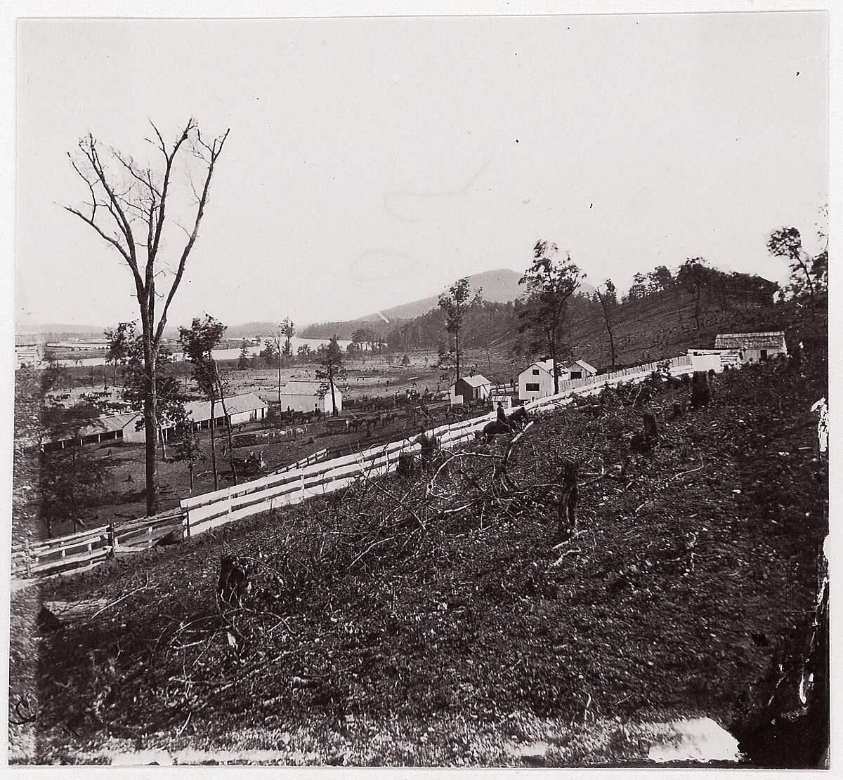 [White picket fence with buildings in background].  Brady album, p. 123, Unknown (American), Albumen silver print from glass negative 