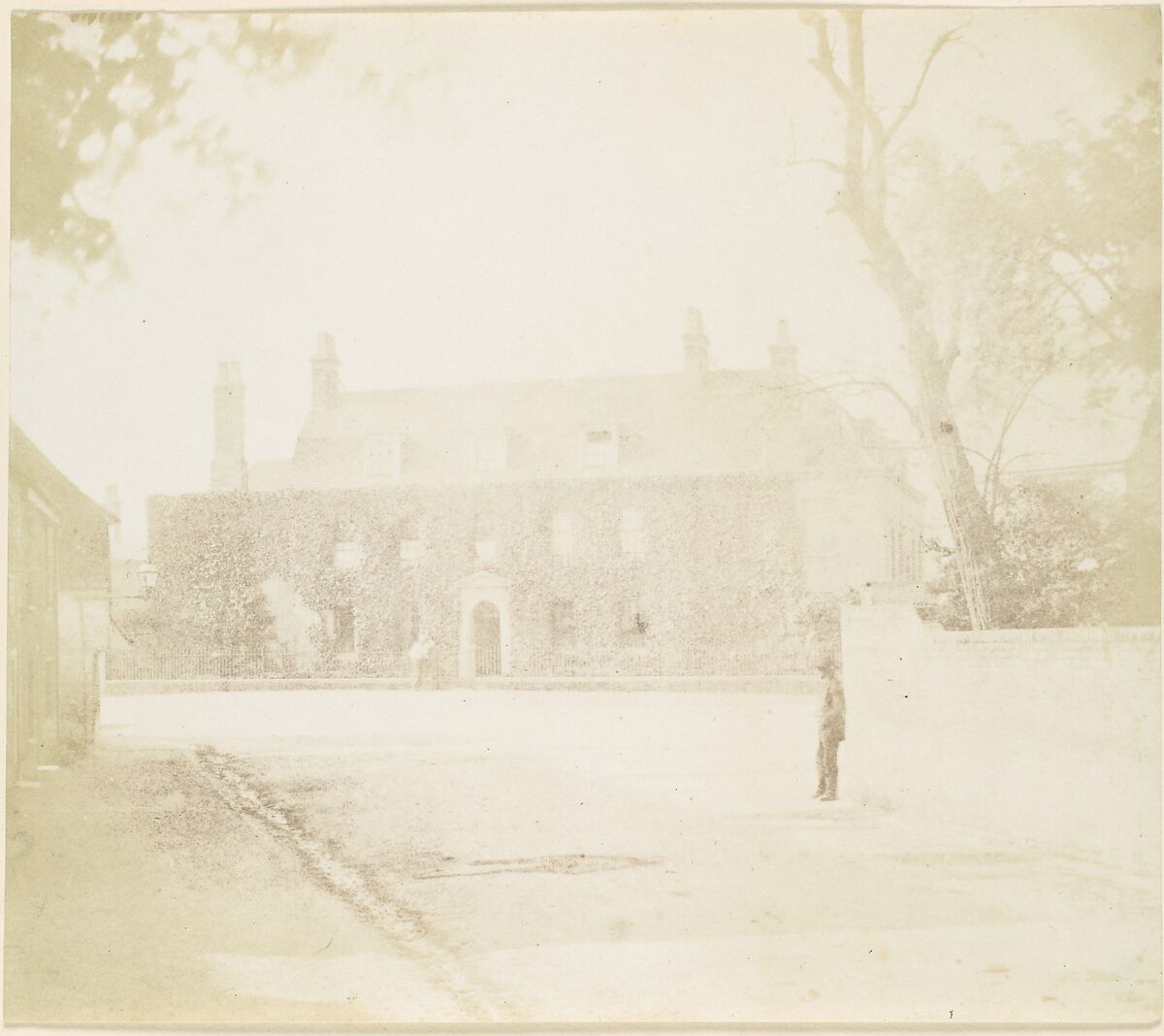 [Man in Courtyard Before House], Unknown (British), Salted paper print from paper negative 