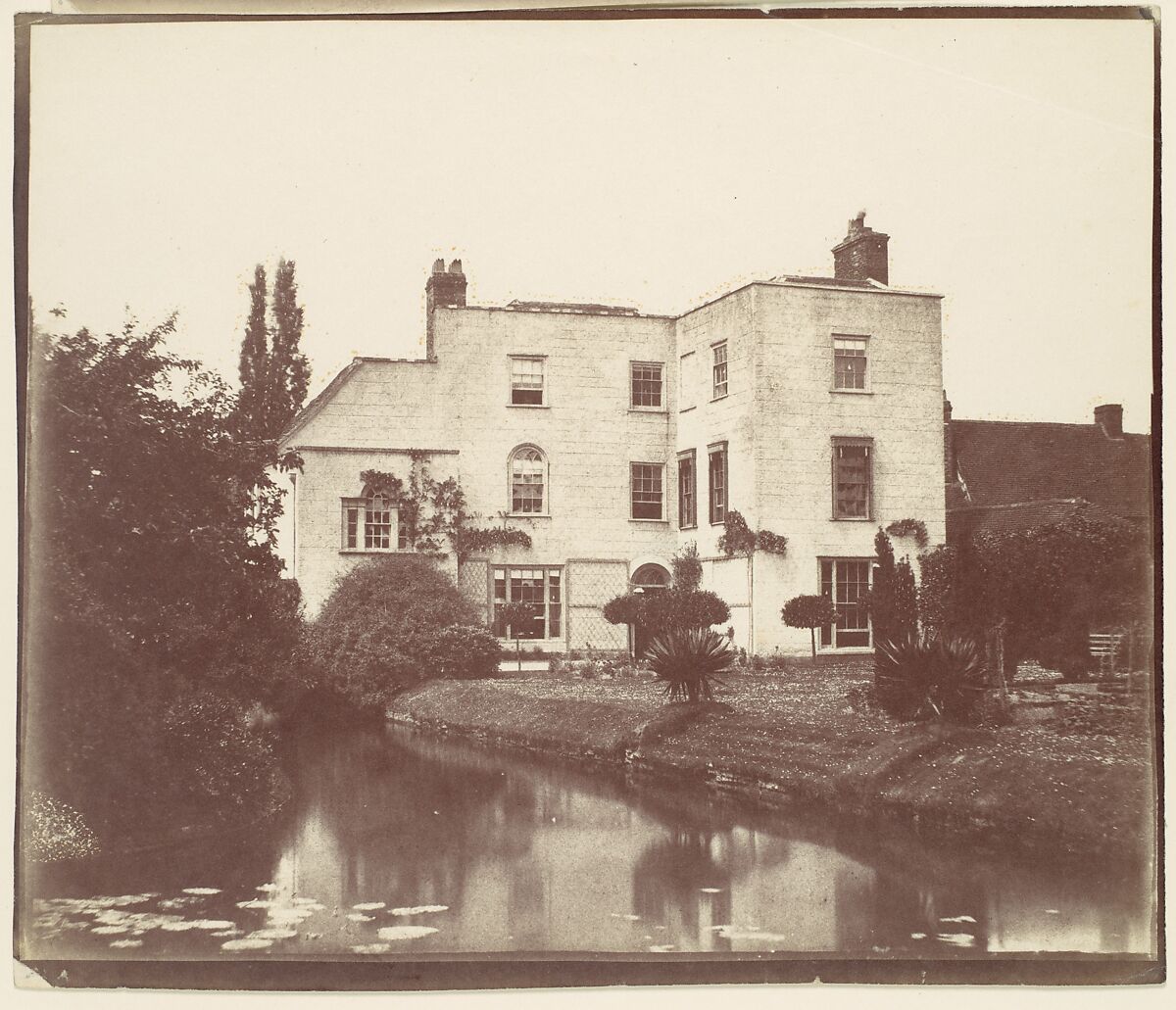 [View of House from Garden by Pond with Lily Pads], Unknown (British), Albumen silver print from paper negative 