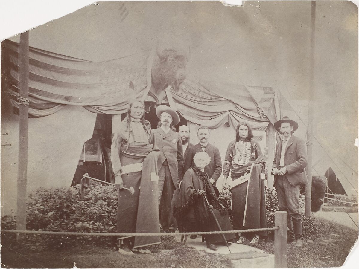[William F. "Buffalo Bill" Cody, Rosa Bonheur, Chief Rocky Bear, Chief Red Shirt, William "Broncho Bill" Irving, Roland Knoedler, and [Benjamin?] Tedesco in front of Cody's Tent at the Paris Exposition Universelle], Unknown (French), Gelatin silver print 