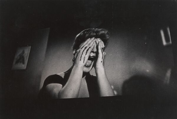 Screaming woman with blood on her hands