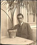 [Walker Evans Seated at Café Table with Potted Palm, Juan-les-Pins, France], Unknown, Gelatin silver print