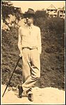 [Walker Evans Wearing Hat and Leaning on Cane, Ossining, New York]