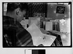 [Walker Evans Reading in Bateau Ivre Bookshop, Juan-les-Pins, France], Unknown, Film negative