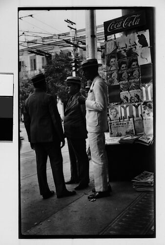 [Three Men in Front of Newspaper Kiosk, Havana]