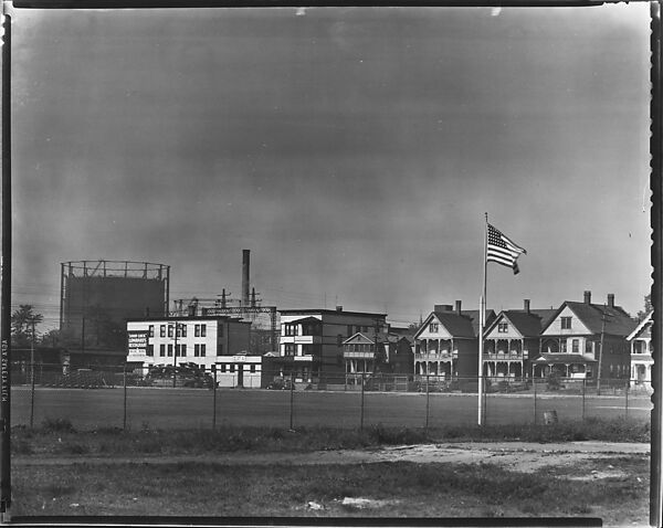 [Houses and Oil Refinery Across Baseball Field with Flag in Foreground, Bridgeport, Connecticut], Walker Evans (American, St. Louis, Missouri 1903–1975 New Haven, Connecticut), Film negative 
