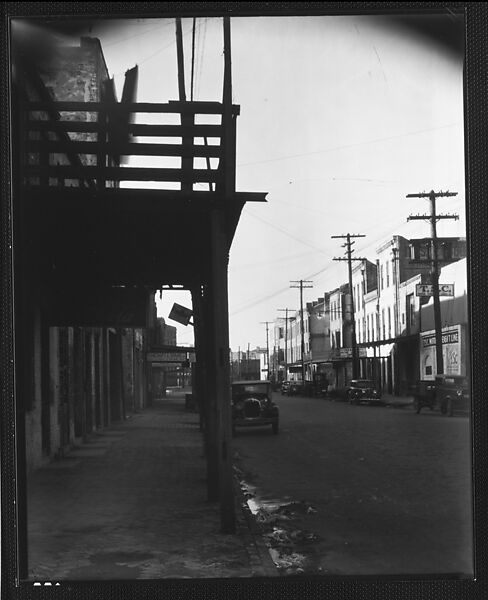 [Parked Cars and Warehouse Buildings on Cobblestone Street With Colonnade in Foreground, New Orleans, Louisiana?], Walker Evans (American, St. Louis, Missouri 1903–1975 New Haven, Connecticut), Film negative 