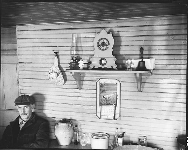 [Man in Cap Seated at Table Below Mantle with Clock, Kerosene Lamp, and Bell, Ossining, New York], Walker Evans (American, St. Louis, Missouri 1903–1975 New Haven, Connecticut), Film negative 