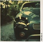 [Car Headlight with Tape Strips], Hank O'Neal, Instant internal dye diffusion transfer print (Polaroid SX-70)