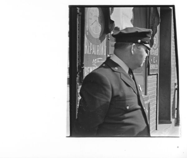 [Three 35mm Film Frames: Man and Policeman in Conversation Outside Watch Repair Shop, Partial View of Man on Street Looking at Camera, Policeman on Street Outside Watch Repair Shop, New York City], Walker Evans (American, St. Louis, Missouri 1903–1975 New Haven, Connecticut), Film negative