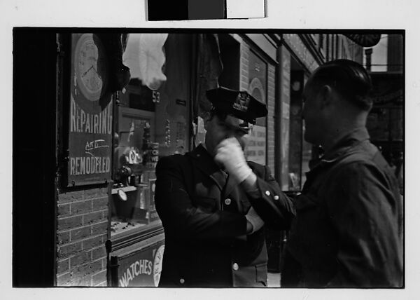 [Two 35mm Film Frames: Man and Policeman on Street Outside Watch Repair Shop, New York City], Walker Evans (American, St. Louis, Missouri 1903–1975 New Haven, Connecticut), Film negative 