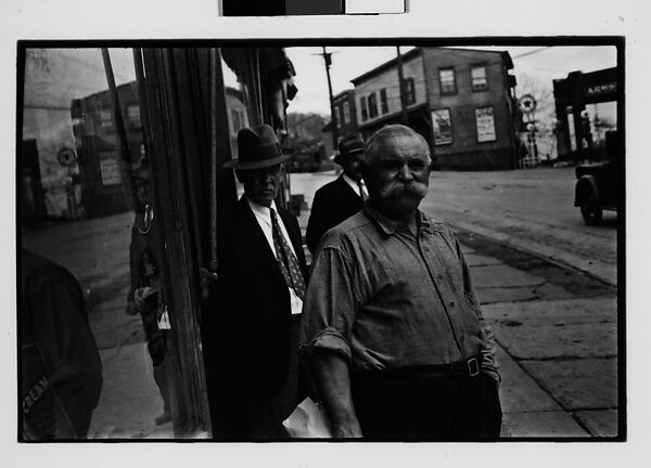 [Three 35mm Film Frames: Shopkeeper with Broom on Sidewalk, Man with Handlebar Moustache on Sidewalk, Ossining, New York], Walker Evans (American, St. Louis, Missouri 1903–1975 New Haven, Connecticut), Film negative