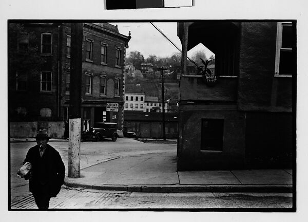 [Two 35mm Film Frames: Street Corner with Pedestrian in Foreground, Woman on Balcony, Ossining, New York], Walker Evans (American, St. Louis, Missouri 1903–1975 New Haven, Connecticut), Film negative 