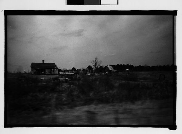 [Wooden House in Field, From Moving Automobile, Macon, Georgia]