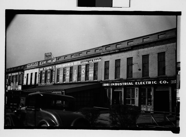 [Warehouse Buildings with Parked Car in Foreground, Savannah, Georgia]