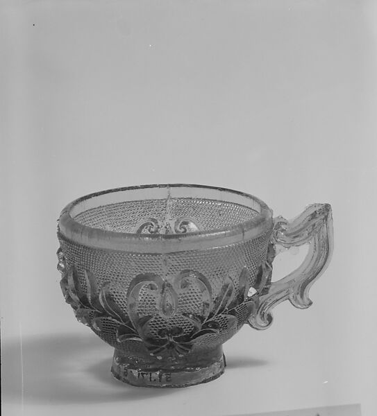 Cup, Lacy pressed green glass 