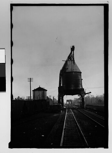 [Industrial Tower Over Railroad Tracks, From Train, Savannah, Georgia]