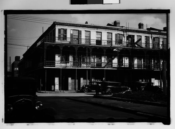 [Cast-Iron Balconied Houses with Parked Cars and Pedestrian on Street Corner, Mobile, Alabama], Walker Evans (American, St. Louis, Missouri 1903–1975 New Haven, Connecticut), Film negative 