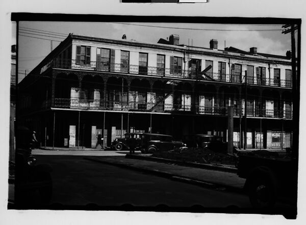 [Cast-Iron Balconied Houses with Parked Cars and Pedestrian on Street Corner, Mobile, Alabama], Walker Evans (American, St. Louis, Missouri 1903–1975 New Haven, Connecticut), Film negative 