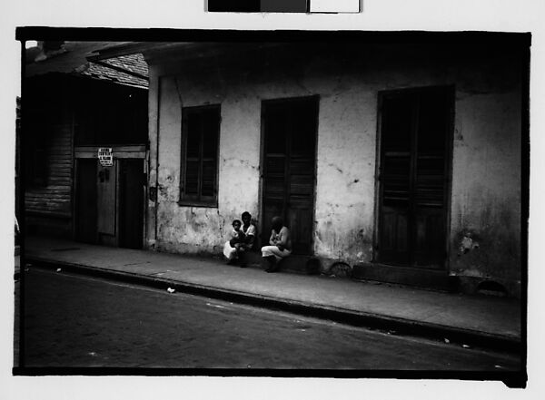 [Two Women and Child Seated on Stoop in French Quarter, New Orleans, Louisiana]