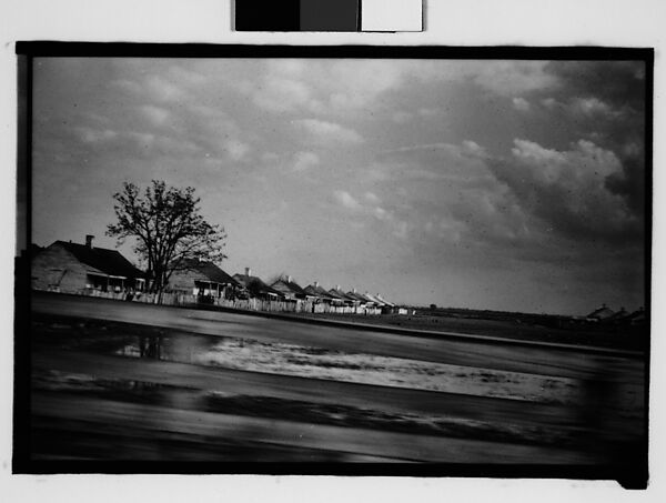 [Row of Wooden Houses Behind Slat Fence, From Moving Automobile, New Orleans Vicinity, Louisiana], Walker Evans (American, St. Louis, Missouri 1903–1975 New Haven, Connecticut), Film negative 