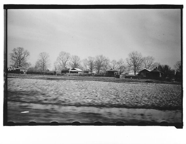 [Wooden Houses Behind Fence in Field, From Moving Automobile, Louisiana], Walker Evans (American, St. Louis, Missouri 1903–1975 New Haven, Connecticut), Film negative 