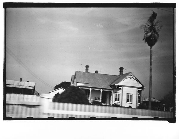 [Queen Anne House with Spindlework Porch and Gable Ornament, From Moving Automobile, Louisiana], Walker Evans (American, St. Louis, Missouri 1903–1975 New Haven, Connecticut), Film negative 