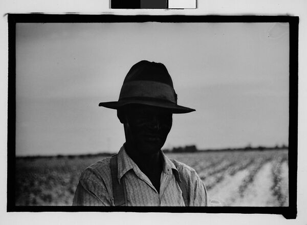 [Man Wearing Hat and Suspenders with Field in Background, Hale County?, Alabama]