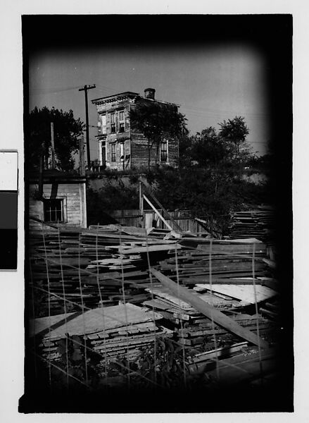 [Thirty 35mm Film Frames on Uncut Roll: of Headstones, A War Medallion, and An Abandoned House Next to A Lumberyard, New Castle, Delaware and Washington, D.C.], Walker Evans (American, St. Louis, Missouri 1903–1975 New Haven, Connecticut), Film negative
