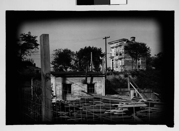 [Thirty 35mm Film Frames on Uncut Roll: of Headstones, A War Medallion, and An Abandoned House Next to A Lumberyard, New Castle, Delaware and Washington, D.C.], Walker Evans (American, St. Louis, Missouri 1903–1975 New Haven, Connecticut), Film negative