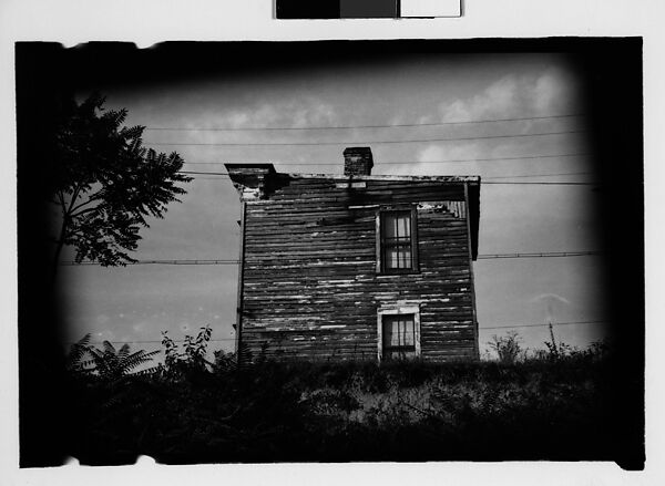 [Thirty 35mm Film Frames on Uncut Roll: of Headstones, A War Medallion, and An Abandoned House Next to A Lumberyard, New Castle, Delaware and Washington, D.C.], Walker Evans (American, St. Louis, Missouri 1903–1975 New Haven, Connecticut), Film negative