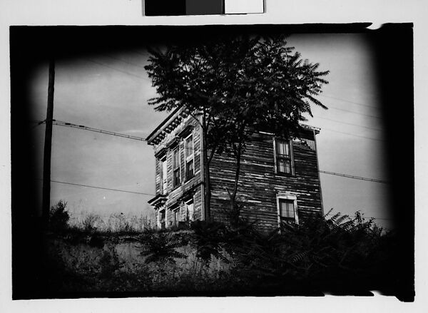 [Thirty 35mm Film Frames on Uncut Roll: of Headstones, A War Medallion, and An Abandoned House Next to A Lumberyard, New Castle, Delaware and Washington, D.C.], Walker Evans (American, St. Louis, Missouri 1903–1975 New Haven, Connecticut), Film negative