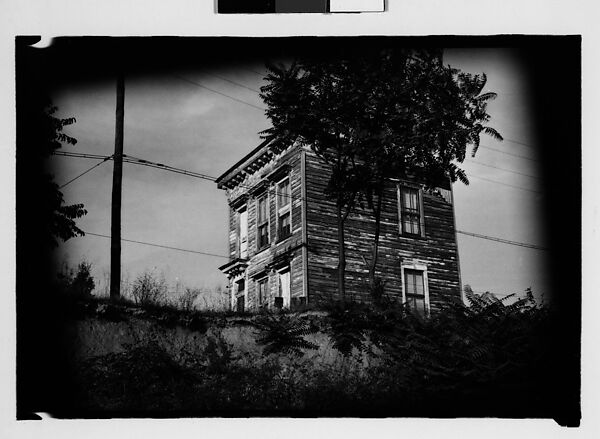 [Thirty 35mm Film Frames on Uncut Roll: of Headstones, A War Medallion, and An Abandoned House Next to A Lumberyard, New Castle, Delaware and Washington, D.C.], Walker Evans (American, St. Louis, Missouri 1903–1975 New Haven, Connecticut), Film negative