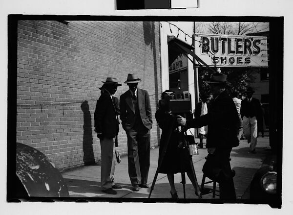 [Thirty-One 35mm Film Frames on Uncut Roll of People on Street, Including 3 of A Tintype Photographer at Work, Tallahassee, Florida], Walker Evans (American, St. Louis, Missouri 1903–1975 New Haven, Connecticut), Film negative