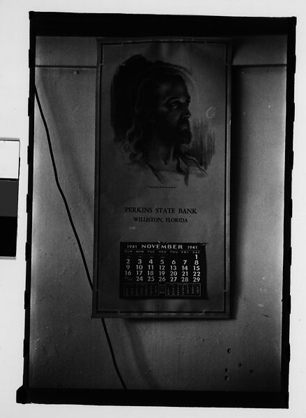 [Seven 35mm Film Frames on Uncut Roll: 5 Views of Wagons and Buildings at Ringling Brothers Circus Winter Quarters, Sarasota, Florida, 1 Study of Illustrated Bank Calendar for November 1941, and 1 Test Frame Inside Automobile], Walker Evans (American, St. Louis, Missouri 1903–1975 New Haven, Connecticut), Film negative