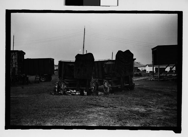 [Seven 35mm Film Frames on Uncut Roll: 5 Views of Wagons and Buildings at Ringling Brothers Circus Winter Quarters, Sarasota, Florida, 1 Study of Illustrated Bank Calendar for November 1941, and 1 Test Frame Inside Automobile], Walker Evans (American, St. Louis, Missouri 1903–1975 New Haven, Connecticut), Film negative