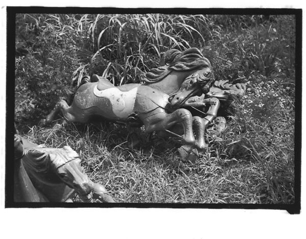 [Twenty-Two 35mm Film Frames on Uncut Roll: 21 Studies of Dismounted Carousel Horses in Field, and 1 View of Parked Automobile in Front of Roadside Building], Walker Evans (American, St. Louis, Missouri 1903–1975 New Haven, Connecticut), Film negative