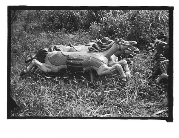 [Twenty-Two 35mm Film Frames on Uncut Roll: 21 Studies of Dismounted Carousel Horses in Field, and 1 View of Parked Automobile in Front of Roadside Building], Walker Evans (American, St. Louis, Missouri 1903–1975 New Haven, Connecticut), Film negative