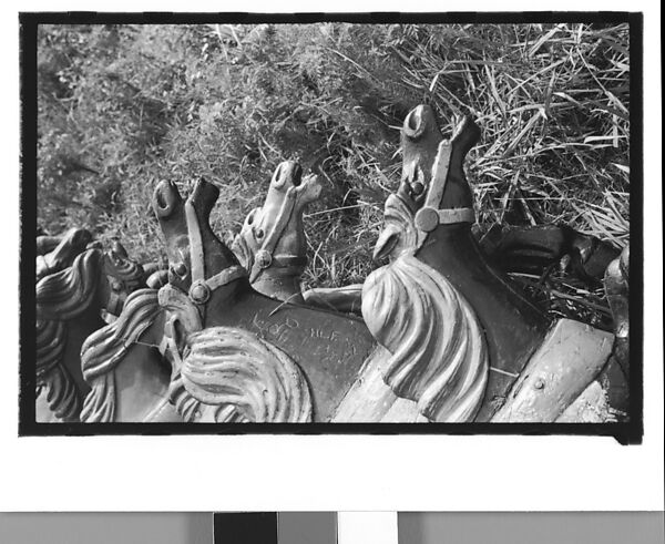 [Twenty-Two 35mm Film Frames on Uncut Roll: 21 Studies of Dismounted Carousel Horses in Field, and 1 View of Parked Automobile in Front of Roadside Building], Walker Evans (American, St. Louis, Missouri 1903–1975 New Haven, Connecticut), Film negative