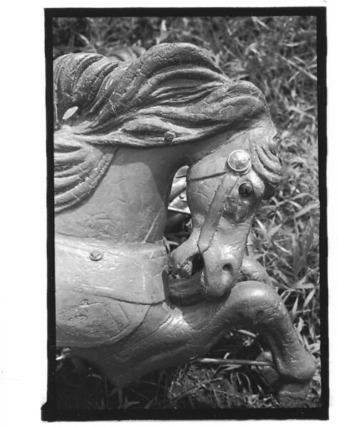 [Twenty-Two 35mm Film Frames on Uncut Roll: 21 Studies of Dismounted Carousel Horses in Field, and 1 View of Parked Automobile in Front of Roadside Building], Walker Evans (American, St. Louis, Missouri 1903–1975 New Haven, Connecticut), Film negative