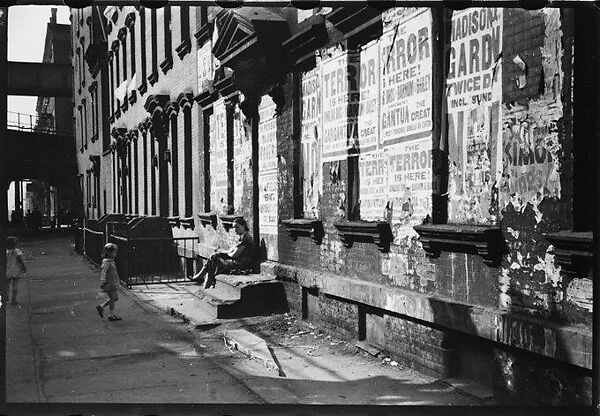 [Five 35mm Film Frames: View Down Street in Hell's Kitchen with Children on Stoop and Torn Circus Posters, New York City]