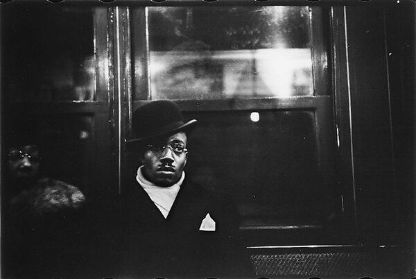 [Four 35mm Film Frames: Subway Passengers, New York City: Man in Derby, Subway Car, Man in Cap and Scarf]