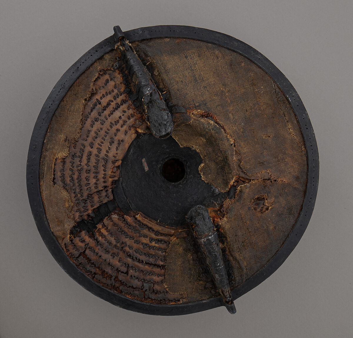 Buckler, Iron, pigskin, brass, wood, fiber (flax), linen, British, Wrexham, Wales