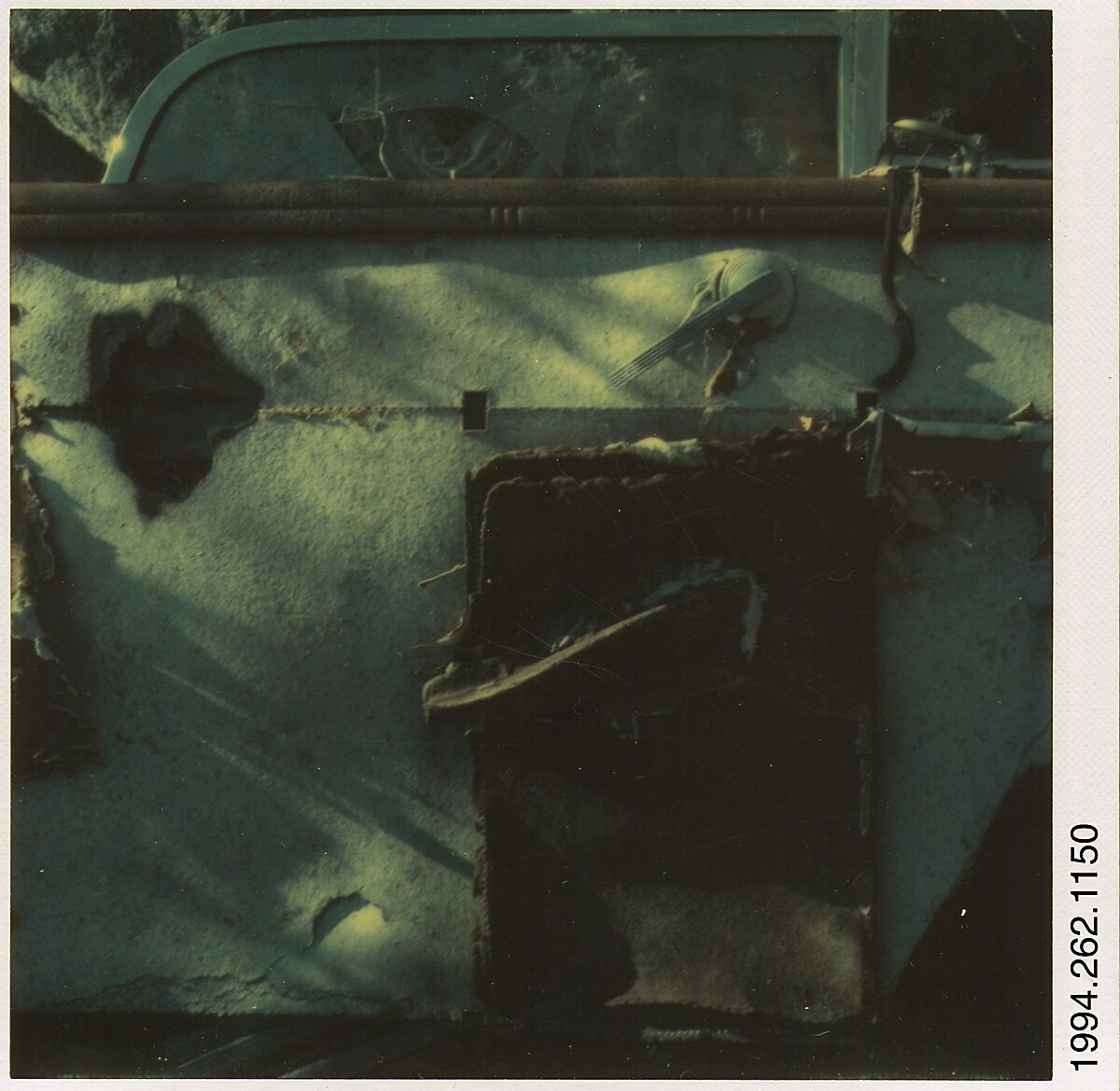 [Auto Junkyard, Old Lyme, Connecticut: Door], Walker Evans (American, St. Louis, Missouri 1903–1975 New Haven, Connecticut), Instant internal dye diffusion transfer print (Polaroid SX-70) 