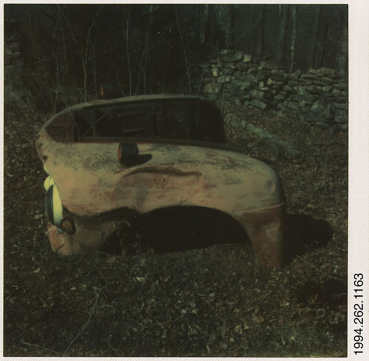 [Auto Junkyard, Old Lyme, Connecticut: Ford Truck Fenders], Walker Evans (American, St. Louis, Missouri 1903–1975 New Haven, Connecticut), Instant internal dye diffusion transfer print (Polaroid SX-70) 