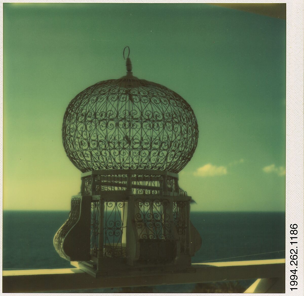 [Birdcage on Railing, Royal Pavilion, Brighton, England], Walker Evans (American, St. Louis, Missouri 1903–1975 New Haven, Connecticut), Instant internal dye diffusion transfer print (Polaroid SX-70) 