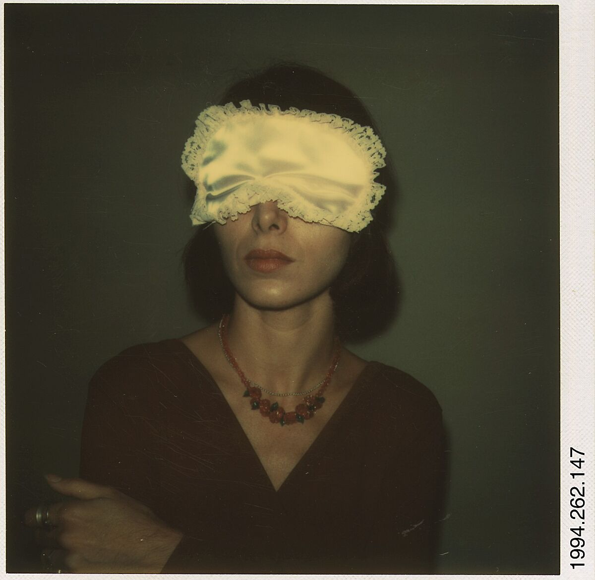 [Joyce Baronio Wearing Sleep Mask], Walker Evans (American, St. Louis, Missouri 1903–1975 New Haven, Connecticut), Instant internal dye diffusion transfer print (Polaroid SX-70) 